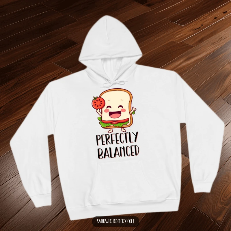 Funny hoodie featuring a jovial sandwich character balancing a tomato slice on its edge, perfect for cozy, composed moments.